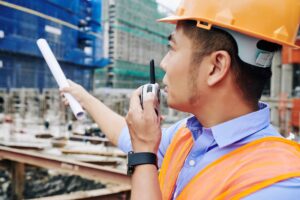 Contractor talking on walkie-talkie